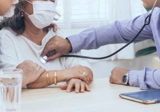 doctor checking senior patient